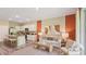 Cozy living room with kitchen island, modern decor, stylish furnishings, and neutral colors at 17485 Spanish Oak Loop, Land O Lakes, FL 34638