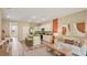 Open-concept space with a kitchen island, modern decor, stylish furnishings, and neutral colors at 17485 Spanish Oak Loop, Land O Lakes, FL 34638