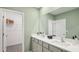 Bathroom vanity featuring double sinks and ample counter space at 17491 Spanish Oak Loop, Land O Lakes, FL 34638