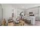 Modern dining area with beautiful decor next to the kitchen and island seating at 17491 Spanish Oak Loop, Land O Lakes, FL 34638