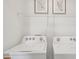 Laundry room with side-by-side washer and dryer at 17491 Spanish Oak Loop, Land O Lakes, FL 34638