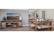 Open-concept dining area and living room with lots of natural light at 17491 Spanish Oak Loop, Land O Lakes, FL 34638