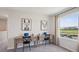 Upstairs office space with dual desks, water view, and natural light at 17491 Spanish Oak Loop, Land O Lakes, FL 34638