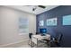 Office with a modern desk and a ceiling fan at 17491 Spanish Oak Loop, Land O Lakes, FL 34638