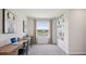 A bright office space with dual desks, a view of the water, and modern decor at 17491 Spanish Oak Loop, Land O Lakes, FL 34638
