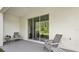 Relaxing patio featuring sliding glass doors to the backyard and comfortable outdoor seating at 17491 Spanish Oak Loop, Land O Lakes, FL 34638