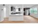 Bright kitchen features stainless steel appliances, modern cabinetry, and breakfast bar at 209 Se Jefferson N Cir, St Petersburg, FL 33702