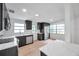 Modern kitchen featuring stainless appliances and dark wood cabinets at 209 Se Jefferson N Cir, St Petersburg, FL 33702