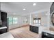 Bright, modern kitchen with dark cabinets, stainless steel appliances at 209 Se Jefferson N Cir, St Petersburg, FL 33702