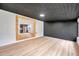 Open living space with access to modern kitchen and wood flooring at 209 Se Jefferson N Cir, St Petersburg, FL 33702