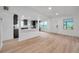 Spacious living area with open kitchen view and abundant natural light at 209 Se Jefferson N Cir, St Petersburg, FL 33702