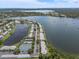 Gorgeous aerial perspective of lakefront condos, tennis courts, and tranquil waters at 225 Pompano Se Dr # D, St Petersburg, FL 33705