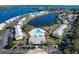 Community aerial view features a central pool, water views, and well-manicured landscaping at 225 Pompano Se Dr # D, St Petersburg, FL 33705