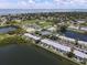 Aerial view of condo community featuring waterways, sports fields, and scenic landscape at 225 Pompano Se Dr # D, St Petersburg, FL 33705