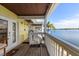 Balcony with a view of waterfront; bright with painted floor and ceiling and safety rail at 225 Pompano Se Dr # D, St Petersburg, FL 33705