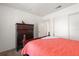 Bedroom with a wooden dresser and wardrobe, featuring view of the room from the foot of the bed at 225 Pompano Se Dr # D, St Petersburg, FL 33705
