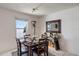 Bright dining area with a table set for dinner, a bar, and a large window with water views at 225 Pompano Se Dr # D, St Petersburg, FL 33705