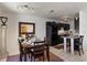 Dining area with table set for dinner, a decorated serving station, and view of the adjacent eat-in kitchen at 225 Pompano Se Dr # D, St Petersburg, FL 33705