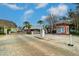 Gated entrance to the community with lush landscaping, brick paved drive and a visitors kiosk at 225 Pompano Se Dr # D, St Petersburg, FL 33705