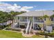 Inviting two-story townhouse featuring a private patio and white exterior staircase at 225 Pompano Se Dr # D, St Petersburg, FL 33705