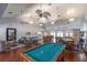 Bright game room featuring a pool table, table tennis and cozy seating for entertainment at 225 Pompano Se Dr # D, St Petersburg, FL 33705