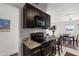 Efficient kitchen featuring granite countertops, black appliances, and a view into the dining area at 225 Pompano Se Dr # D, St Petersburg, FL 33705