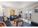 Inviting living room featuring stylish furnishings, colorful decor, and access to a private balcony at 225 Pompano Se Dr # D, St Petersburg, FL 33705