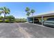 Carport parking area with covered spaces and lush landscaping, offering shade and convenience at 225 Pompano Se Dr # D, St Petersburg, FL 33705