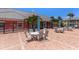 Inviting outdoor patio with tables, chairs and shade for relaxing with views of lush landscaping at 225 Pompano Se Dr # D, St Petersburg, FL 33705