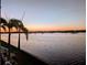 Beautiful sunset view with silhouetted palm trees and several boats docked in the water at 225 Pompano Se Dr # D, St Petersburg, FL 33705