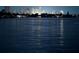 City skyline at night reflected on water, showcasing urban lights and serene water view at 225 Pompano Se Dr # D, St Petersburg, FL 33705