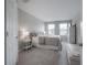 Bedroom with carpet floors, neutral walls, windows with blinds, a bed, and white furnishings at 2469 Stapleford Pl, Wesley Chapel, FL 33543