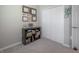 Cozy bedroom with a gray carpet, and a shelf full of certificates at 2469 Stapleford Pl, Wesley Chapel, FL 33543