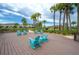 Community deck with seating areas and tranquil water views at 2469 Stapleford Pl, Wesley Chapel, FL 33543