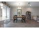 Cozy dining room featuring hardwood floors, chandelier, and wooden dining table set at 2469 Stapleford Pl, Wesley Chapel, FL 33543