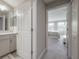 Hallway leading to a bedroom with carpeted floors and doors to bathroom and closet at 2469 Stapleford Pl, Wesley Chapel, FL 33543
