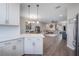Open-concept living room with kitchen, dining area, and comfortable seating with great flow for entertaining at 2469 Stapleford Pl, Wesley Chapel, FL 33543