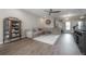 Comfortable living room featuring a large sectional sofa and stylish decor at 2469 Stapleford Pl, Wesley Chapel, FL 33543