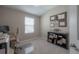 Office with computer, desk, printer, black shelving unit and window with blinds at 2469 Stapleford Pl, Wesley Chapel, FL 33543