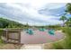 Relaxing pond view from a sitting platform with Adirondack chairs at 2469 Stapleford Pl, Wesley Chapel, FL 33543