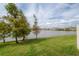 Scenic water view featuring lush greenery and a beautiful lake at 2469 Stapleford Pl, Wesley Chapel, FL 33543