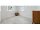 Empty room with white walls, light gray flooring, and vintage furnishings at 3633 Odom Dr, New Port Richey, FL 34652