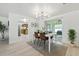 Dining area featuring modern lighting, neutral decor, and sliding doors to the outside at 3633 Odom Dr, New Port Richey, FL 34652