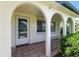 Charming front porch with arched supports and tile flooring at 3633 Odom Dr, New Port Richey, FL 34652