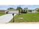 Well maintained home with an arched front porch and long driveway at 3633 Odom Dr, New Port Richey, FL 34652