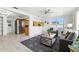 Open-concept living room and kitchen area, showcasing the bright and airy layout of the home at 3633 Odom Dr, New Port Richey, FL 34652