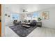 Inviting living room with ample natural light, comfortable seating, and a stylish rug that adds character at 3633 Odom Dr, New Port Richey, FL 34652