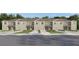 Charming townhome showcases a well-manicured lawn, inviting entrance, and private garage, creating curb appeal at 3647 Copper Beech Drive Loop, Land O Lakes, FL 34638