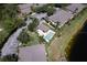 Aerial view of the community pool, parking lot, and surrounding buildings at 3909 45Th W Ter # 102, Bradenton, FL 34210