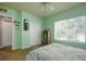 Bright bedroom featuring a large window, neutral carpet, and a ceiling fan at 3909 45Th W Ter # 102, Bradenton, FL 34210